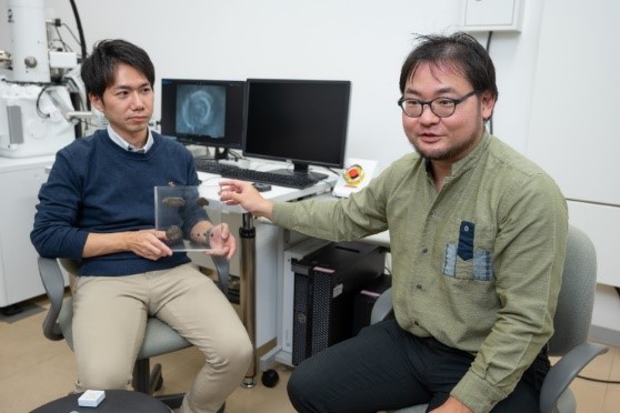 Dr. Kaito Asato explaining about fossil freshwater shellfish